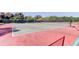Tennis courts for friendly games and fitness with well-maintained surface and surrounding greenery at 8231 Coral Creek Loop, Hudson, FL 34667