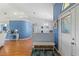 Inviting entryway showcasing a white bench and light blue walls at 8231 Coral Creek Loop, Hudson, FL 34667