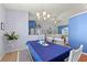 Spacious dining area with blue and white decor and a view to the living room at 8231 Coral Creek Loop, Hudson, FL 34667