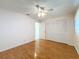 Bright bedroom with wood flooring, ceiling fan and closet at 10534 Calico Loop, Port Richey, FL 34668