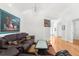 Living room with hardwood floors, and dark leather sofas at 10906 New Brighton Ct, New Port Richey, FL 34654