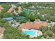 Aerial view of community clubhouse, pool, and tennis courts at 11909 Wexford Blvd, Spring Hill, FL 34609