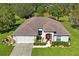 Single-story home with a two-car garage and well-manicured lawn at 11909 Wexford Blvd, Spring Hill, FL 34609