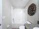 Small bathroom with shower/tub combo, toilet and granite vanity at 16864 Red Brick Ln, Land O Lakes, FL 34638