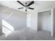 Spacious bedroom with ceiling fan and closet at 16864 Red Brick Ln, Land O Lakes, FL 34638