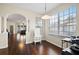 Bright breakfast nook with hardwood floors and view to living room at 1931 Sassafras Dr, Wesley Chapel, FL 33543