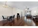 Living room with hardwood floors, comfortable seating, and a dining area at 1931 Sassafras Dr, Wesley Chapel, FL 33543