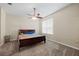 Main bedroom with ceiling fan and large window at 1931 Sassafras Dr, Wesley Chapel, FL 33543