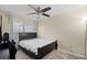 Spacious bedroom with ceiling fan and large window at 1931 Sassafras Dr, Wesley Chapel, FL 33543