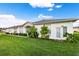 Charming single-story home with well-maintained lawn and garden in a quiet neighborhood setting at 1931 Sassafras Dr, Wesley Chapel, FL 33543