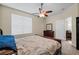 Bedroom with ceiling fan and dresser at 1931 Sassafras Dr, Wesley Chapel, FL 33543