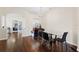 Bright dining room with hardwood floors and a glass table at 1931 Sassafras Dr, Wesley Chapel, FL 33543