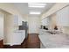 Modern kitchen with white cabinets and granite countertops at 1931 Sassafras Dr, Wesley Chapel, FL 33543