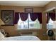 Bedroom with window, mirror, and fan at 20857 Haulover Cv # B-13, Lutz, FL 33558