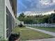 Exterior view of the building with a walkway and fence at 20857 Haulover Cv # B-13, Lutz, FL 33558