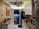 View of kitchen, granite counters and white cabinets at 20857 Haulover Cv # B-13, Lutz, FL 33558