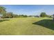 Vast backyard with manicured lawn, providing a picturesque setting and plenty of room to roam at 2293 Dog Leg Ct, Brooksville, FL 34604
