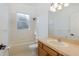 Bright bathroom featuring a shower-tub combination and wooden vanity at 2293 Dog Leg Ct, Brooksville, FL 34604