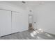 Spacious bedroom boasts a large closet and light gray wood-look flooring at 2293 Dog Leg Ct, Brooksville, FL 34604