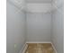 Walk-in closet featuring wire shelving perfect for clothing storage at 2293 Dog Leg Ct, Brooksville, FL 34604