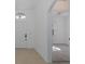 Bright entryway with white walls, tile flooring, and an open doorway to another room at 2293 Dog Leg Ct, Brooksville, FL 34604