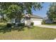 Charming single-story home featuring a well-manicured lawn, two-car garage, and welcoming curb appeal at 2293 Dog Leg Ct, Brooksville, FL 34604