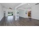 Open living area with tile and wood-look floors and lots of natural light at 2293 Dog Leg Ct, Brooksville, FL 34604