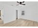 Bright bedroom with ceiling fan, window, and wood-look floors at 4136 9Th N Ave, St Petersburg, FL 33713