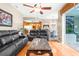 Living room with hardwood floors and view into kitchen and dining areas at 426 Romine Ct, Spring Hill, FL 34609