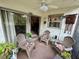Cozy screened porch furnished with comfortable chairs at 427 Windrush Bay Dr # 427, Tarpon Springs, FL 34689