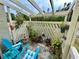 Relaxing patio with pergola, seating, and potted plants at 427 Windrush Bay Dr # 427, Tarpon Springs, FL 34689