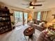 Living room with sofas, coffee table, and view of porch at 427 Windrush Bay Dr # 427, Tarpon Springs, FL 34689