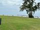 Peaceful waterfront park with benches overlooking the water at 427 Windrush Bay Dr # 427, Tarpon Springs, FL 34689