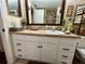 Bathroom with white vanity and a large mirror at 427 Windrush Bay Dr # 427, Tarpon Springs, FL 34689