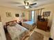 Bedroom with twin beds and dresser at 427 Windrush Bay Dr # 427, Tarpon Springs, FL 34689
