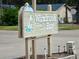 Windrush Bay community entrance sign with sailboat graphic at 427 Windrush Bay Dr # 427, Tarpon Springs, FL 34689