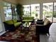 Relaxing community room with wicker furniture and large windows at 427 Windrush Bay Dr # 427, Tarpon Springs, FL 34689