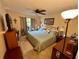 King-size bed, TV, and sliding glass doors at 427 Windrush Bay Dr # 427, Tarpon Springs, FL 34689