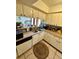 Galley kitchen with double sink, dishwasher and ample cabinets at 427 Windrush Bay Dr # 427, Tarpon Springs, FL 34689