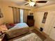Bedroom with twin beds and ceiling fan at 427 Windrush Bay Dr # 427, Tarpon Springs, FL 34689