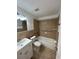 Clean bathroom featuring tiled walls, a vanity sink, and a shower-tub combination at 4913 Hazner St # 4913, New Port Richey, FL 34652