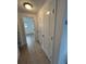 Hallway featuring neutral flooring and two closets leading to bedroom at 4913 Hazner St # 4913, New Port Richey, FL 34652