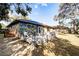 Home's back exterior features a deck and patio at 6084 Pinehurst Dr, Spring Hill, FL 34606