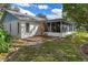 House exterior with screened porch and landscaping at 6423 Lost Tree Ln, Spring Hill, FL 34606