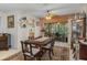 Cozy dining area with a table and access to a screened patio at 6423 Lost Tree Ln, Spring Hill, FL 34606