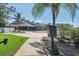 Relaxing pool area with lush landscaping and walkway at 6423 Lost Tree Ln, Spring Hill, FL 34606