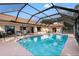 Cool off in this large, refreshing pool with screened enclosure at 6450 Trade Ct, Spring Hill, FL 34606