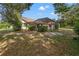 Spacious backyard with a screened pool and lush landscaping at 6450 Trade Ct, Spring Hill, FL 34606