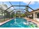 Relax in the screened and refreshing pool area at 6450 Trade Ct, Spring Hill, FL 34606