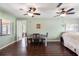 This dining room is complete with a wooden table and two ceiling fans at 6450 Trade Ct, Spring Hill, FL 34606